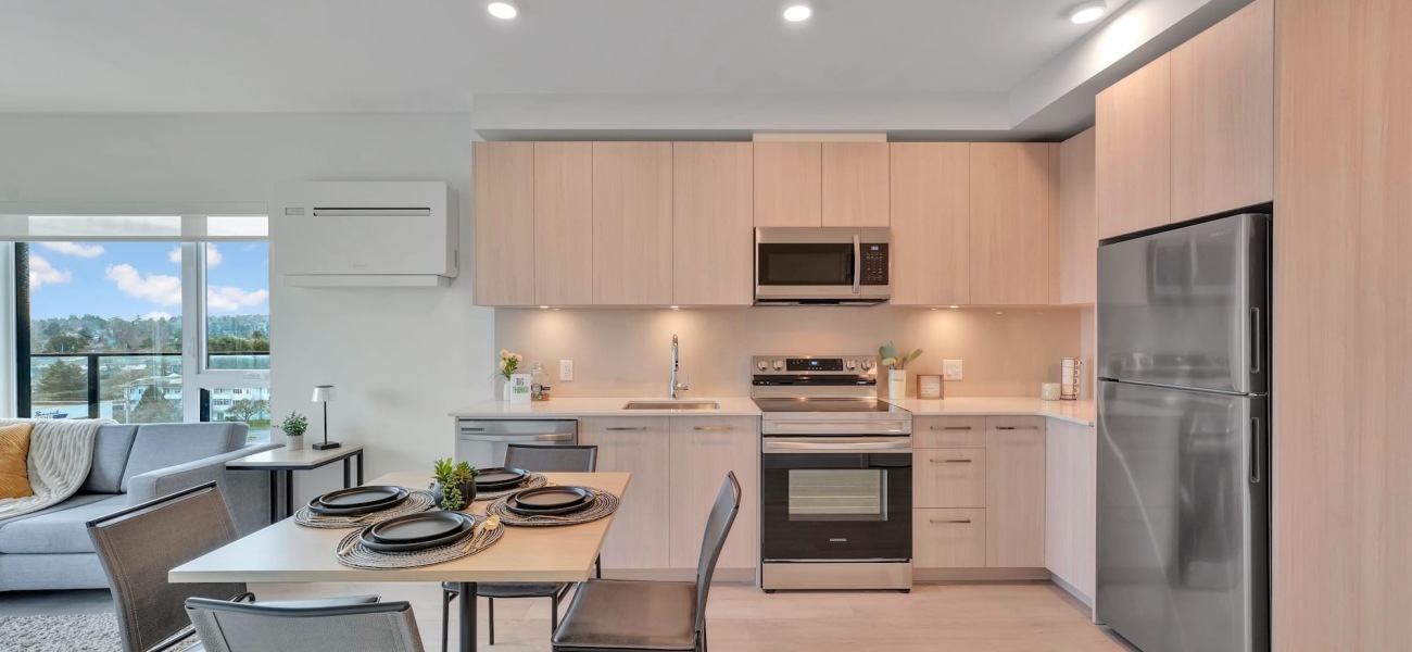 kitchen with ample counter-space, modern appliances and bright lighting